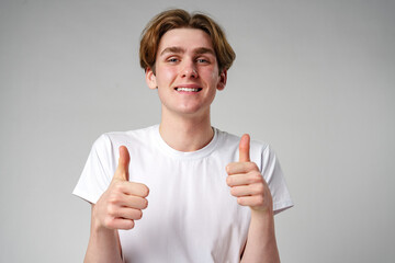 Young Man Giving Thumbs Up Sign