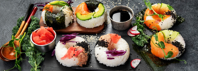 Sushi donuts on a dark background. Hybrid trend food.