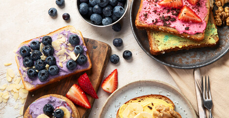 Set with toast bread and different sweet toppings on white background.