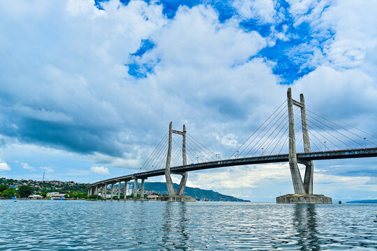 Red and white bridge in Ambon Bay, Indonesia