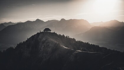 Obraz premium schafberg mountain top with hut at sunset salzburg land austria