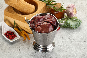 Raw uncooked chicken liver in the bowl