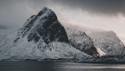 winter morning light on mountain peaks of austvaygacy lofoten islands norway