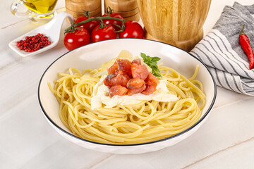 Pasta spaghetti with salmon and stracciatella