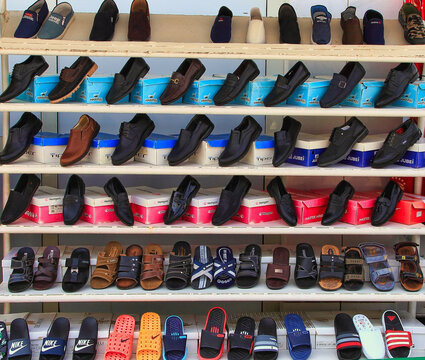Ashgabat, Turkmenistan market - Mart 15.2020: Shelves in a store with a variety of men's shoes