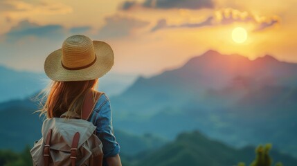 Young woman in straw hat with backpack, sunset mountains, rear view outdoor travel concept