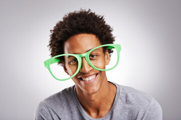Portrait, black man or glasses as funny, joke or vision of comic, customer or service in studio....