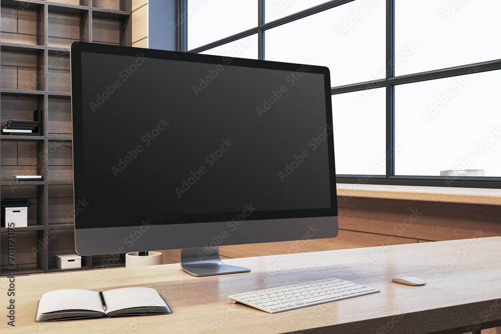 Poster Close up of modern designer office workplace with empty computer monitor, window with city view and wooden shelves in the background. Mock up, 3D Rendering.