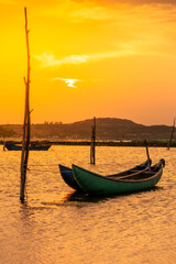 Traditional boats at O Loan lagoon in sunset, Phu Yen province, Vietnam