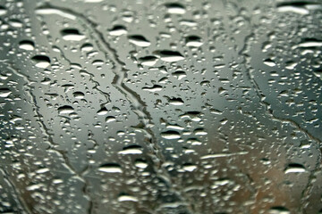 The windshield of a car in the rain