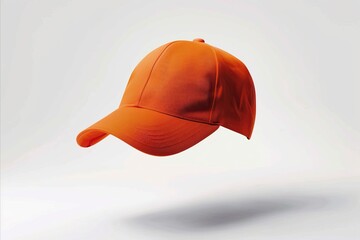 Vibrant orange sports cap floating in the air, isolated on a white background in a detailed, high resolution, professional photograph with sharp focus and very realistic detail, flying angle