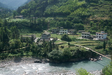 Fototapeta na wymiar river and village in the mountains