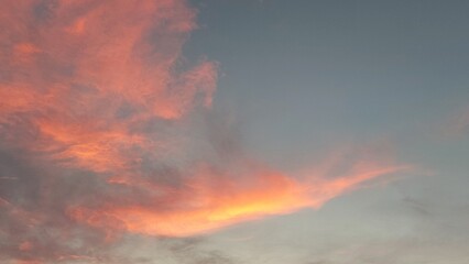 Beautiful orange clouds in the sky at sunset background