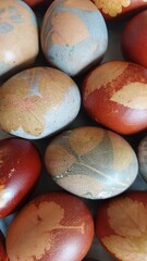 Colorful Easter eggs closeup, decorated with organic paint and floral motifs