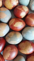 Colorful Easter eggs closeup, decorated with organic paint and floral motifs
