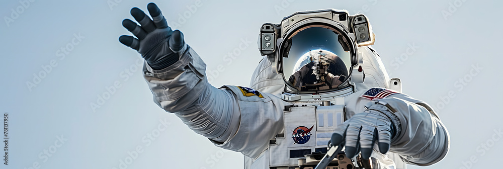 Wall mural an astronaut reaching out towards the viewer against a clear sky backdrop, symbolizing connection an