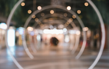 Blurred image of shopping mall with circle tunnel bokeh lights for background usage. - 781138923