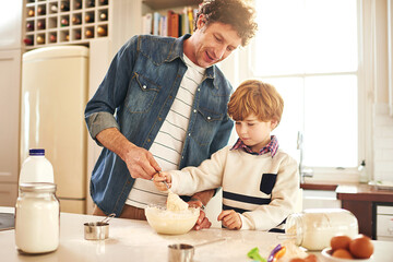Father, son and baking with dough in kitchen for bonding, bread or donut or cake for family. Man,...