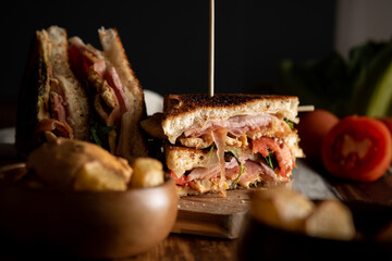Club Sandwich and Spanish Snack Patatas Bravas with Spicy Sauce