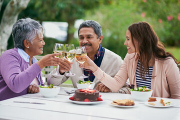Senior, couple and daughter, outdoor and wine for celebration of anniversary of parents with food. Summer, relax and healthy diet, cake and lunch for brunch in backyard or garden, woman and family