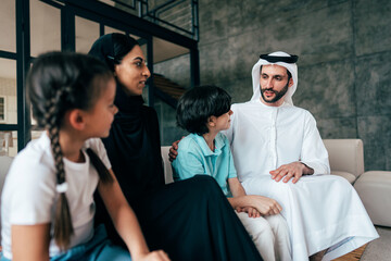 Traditional arabian family from Dubai spending time together at home