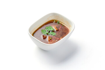  Shiitake mushroom soup in bowl isolated on white background.