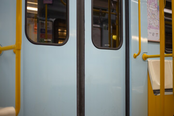Closed doors in a subway car. An empty train waits at the San Donato metro station in Milan. Public transport concept