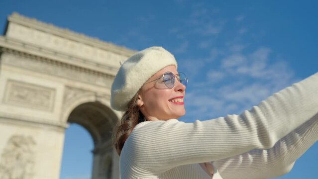 Tourist Photographing Arc de Triomphe