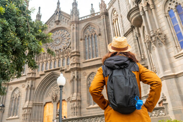 A tourist with a hat visiting the Church of San Juan Bautista, Arucas Cathedral, Gran Canaria,...
