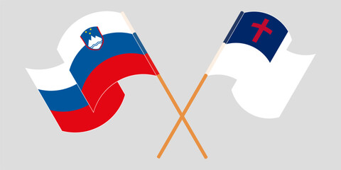 Crossed and waving flags of Slovenia and christianity