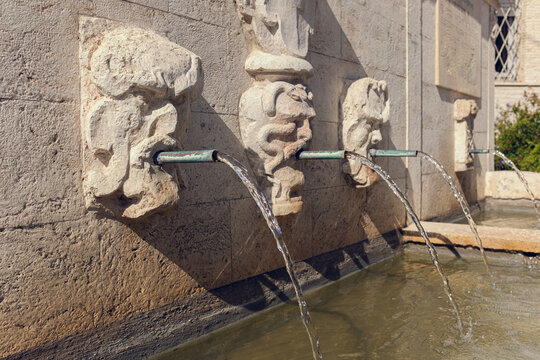 Italian city Numana, downtown, named Fontana del XVII secolo. An ancient antique fountain in the Italian town