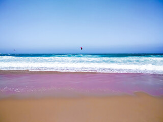 Coast of Portugal. One of the beaches in Cascais with crystal clear water. A great place for water sports - surfing.