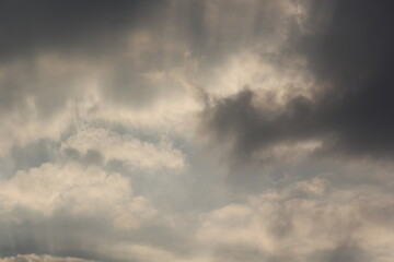 Morning sun rays and clouds with sun fluffy clouds