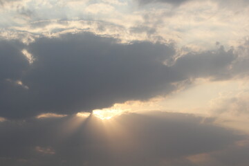 Morning sun rays and clouds with sun fluffy clouds