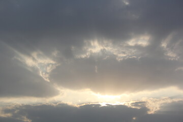 Morning sunrays with sun and clouds