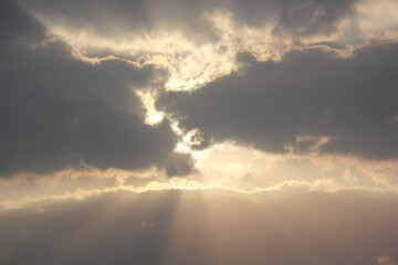 Morning sunrays with sun and clouds