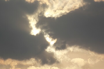 Morning sunrays with sun and clouds