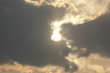 Fototapeta na wymiar Morning sunrays with sun and clouds