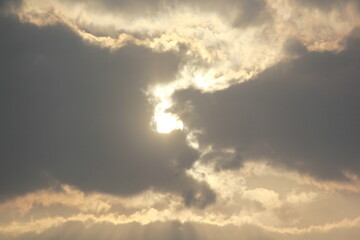 Fototapeta na wymiar Morning sunrays with sun and clouds