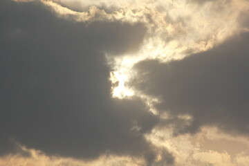 Morning sunrays with sun and clouds