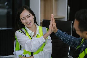 Team architects workers, men and women, join hands to join forces to join forces to work for the industry for success. Teamwork and professional colleagues : Workers' hands, teamwork concept.