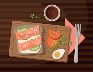 Sandwich with salmon or trout, cream cheese, egg and lettuce leaves. 