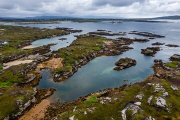 Aerial shot of the shore and the sea in the County Donegal in Ireland on a sunny day