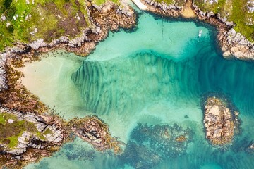 Aerial top view of a beautiful coastline on a sunny day in Donegal - obrazy, fototapety, plakaty