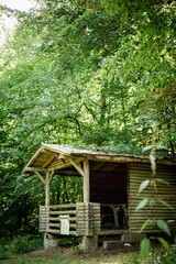 Fototapeta na wymiar Wooden pavilion in forest
