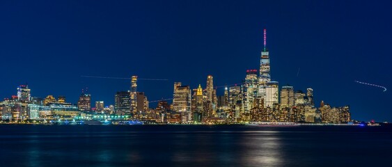 Panoramic view of the New York City Manhattan skyline illuminated with lights