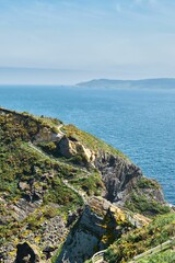 Aerial view of lake surrounded by greenery cliffs