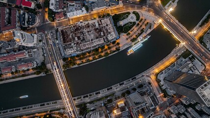 Aerial top view of the Progress Bridge and Bei'an Bridge on the Haihe River in Tianjin at night