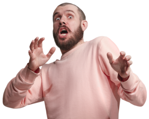 Man in pink sweatshirt being scared, expressing fear isolated on transparent background. Wide open eyes and gesturing. Being afraid of. Concept of human emotions, facial expression.