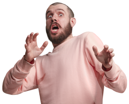 Man in pink sweatshirt being scared, expressing fear isolated on transparent background. Wide open eyes and gesturing. Being afraid of. Concept of human emotions, facial expression.